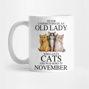 Never Underestimate An Old Lady Who Loves Cats November Mug